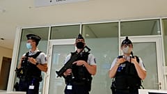 FILE PHOTO: Police officers guard the Palace of Justice Thursday, June 3, 2021 in Paris, France.  