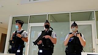 FILE PHOTO: Police officers guard the Palace of Justice Thursday, June 3, 2021 in Paris, France.  