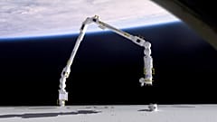 An animation of the ESA robotic arm transporting payloads outside the ISS.