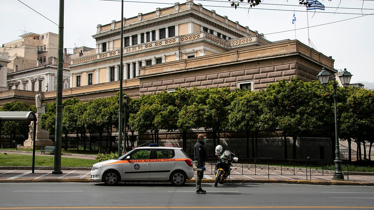 A Greek municipal police officer pictured on patrol in the capital city, Athens.