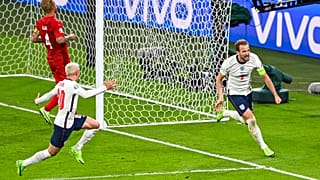England's Harry Kane, right, reacts after scoring his team's second goal during the Euro 2020 soccer championship semifinal between England and Denmark at Wembley stadium.