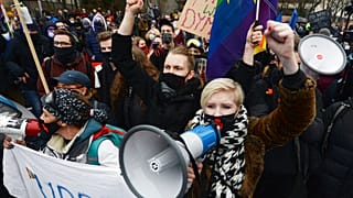 Women protest the newly-introduced, prohibitive abortion law Warsaw on January 27, 2021