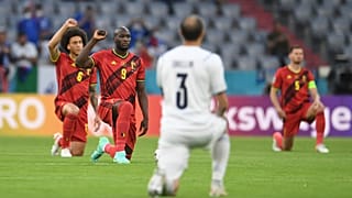 Players take a knee before a Euro 2020 match between Belgium and Italy.