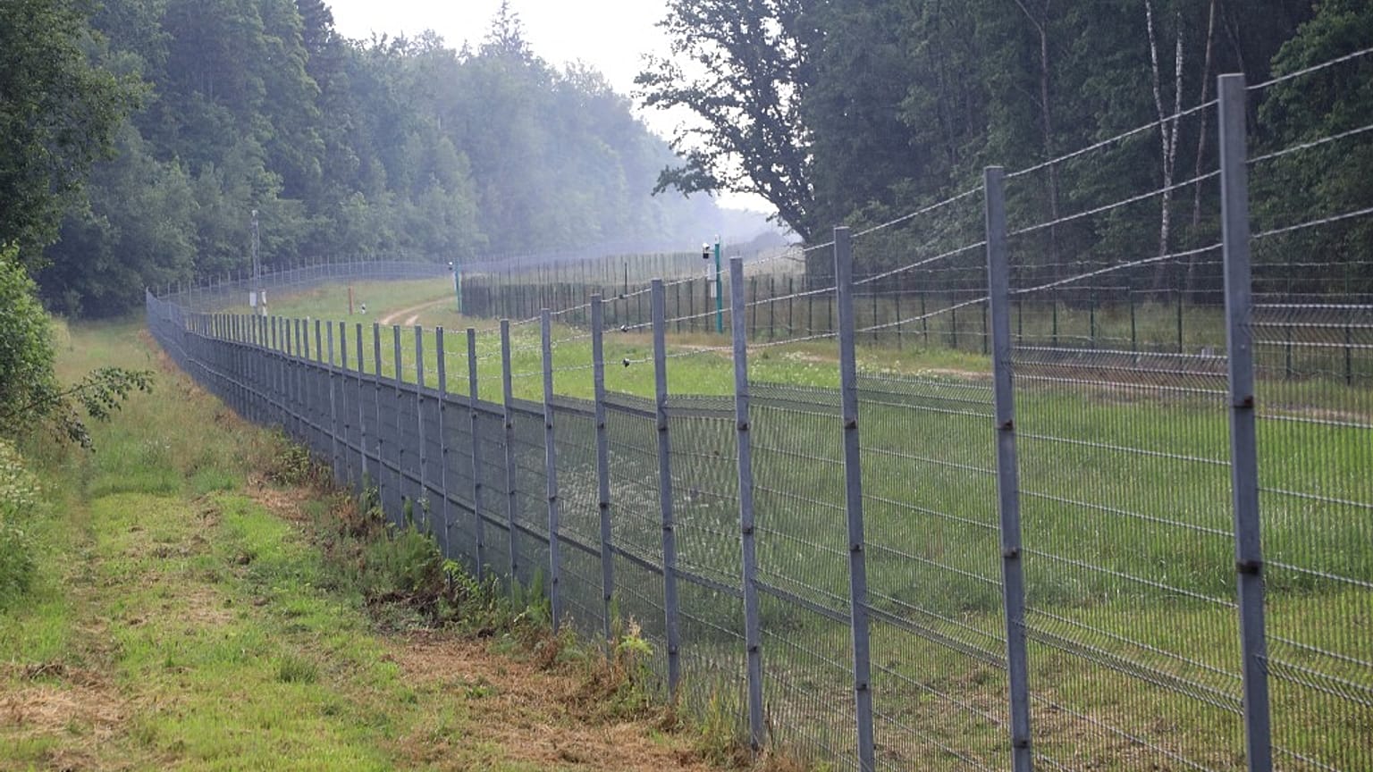 The Padvarionys border fence in Medininkai, separating Lithuania and Belarus.