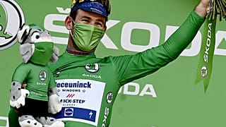 Stage winner Team Deceuninck Quickstep's Mark Cavendish of Great Britain on the podium at the end of the 13th stage of the 108th Tour de France, on July 9, 2021.