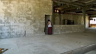  Devla Ajsic walking inside former Dutch U.N. compound where she survived sexual abuse in July 1995