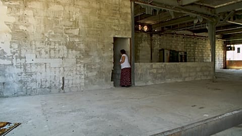  Devla Ajsic walking inside former Dutch U.N. compound where she survived sexual abuse in July 1995