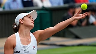 Australia's Ashleigh Barty serves to Czech Republic's Karolina Pliskova during the women's singles final match of the Wimbledon Tennis Championships in London, July 10, 2021. 