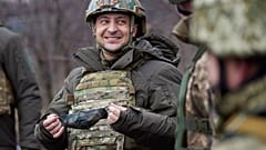 Ukrainian President Volodymyr Zelenskyy talks with servicemen as he visits the war-hit Donetsk region, eastern Ukraine. 