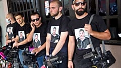 Colleagues of Alexander Lashkarava held a minute of silent during a farewell ceremony in Tbilisi.