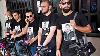 Colleagues of Alexander Lashkarava held a minute of silent during a farewell ceremony in Tbilisi.