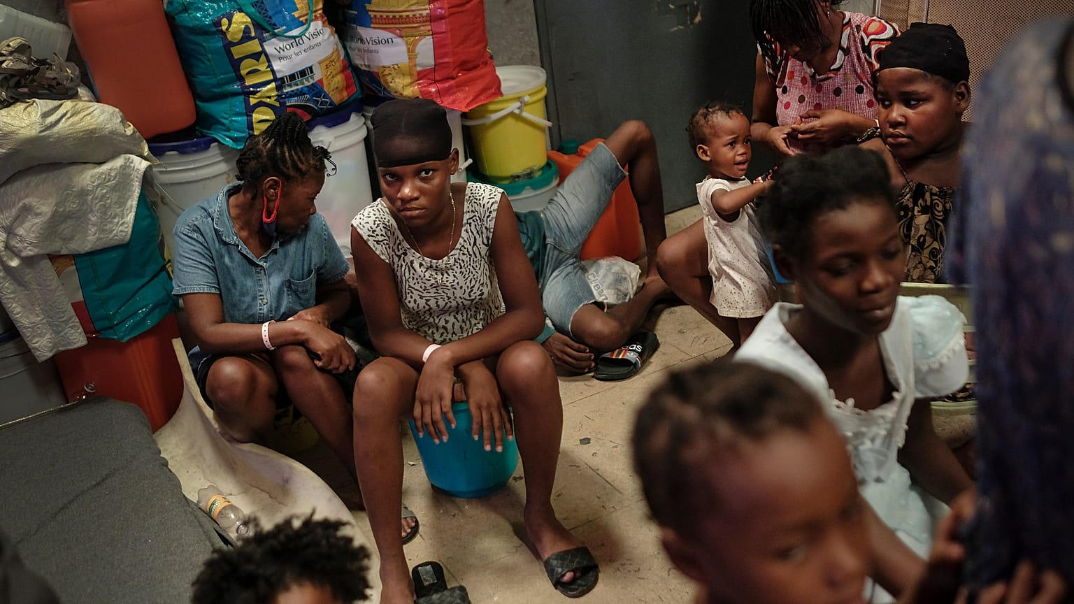 A school turned shelter hosts families displaced by gang violence in Port-au-Prince, Haiti, Tuesday, July 13, 2021.