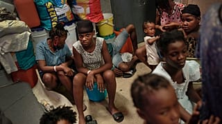 A school turned shelter hosts families displaced by gang violence in Port-au-Prince, Haiti, Tuesday, July 13, 2021.
