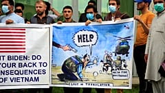 Former Afghan interpreters hold banners during a protest against the U.S. government and NATO in Kabul, Afghanistan on April 30, 2021.