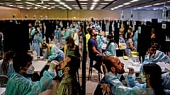 Health workers take swab samples collection for a Covid-19 antigen test ahead of the Cruilla music festival in Barcelona, Spain, July 9, 2021. 