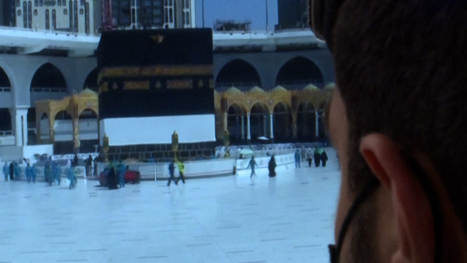 Soldier monitoring security cameras in Mecca in the security operations center 