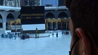 Soldier monitoring security cameras in Mecca in the security operations center 