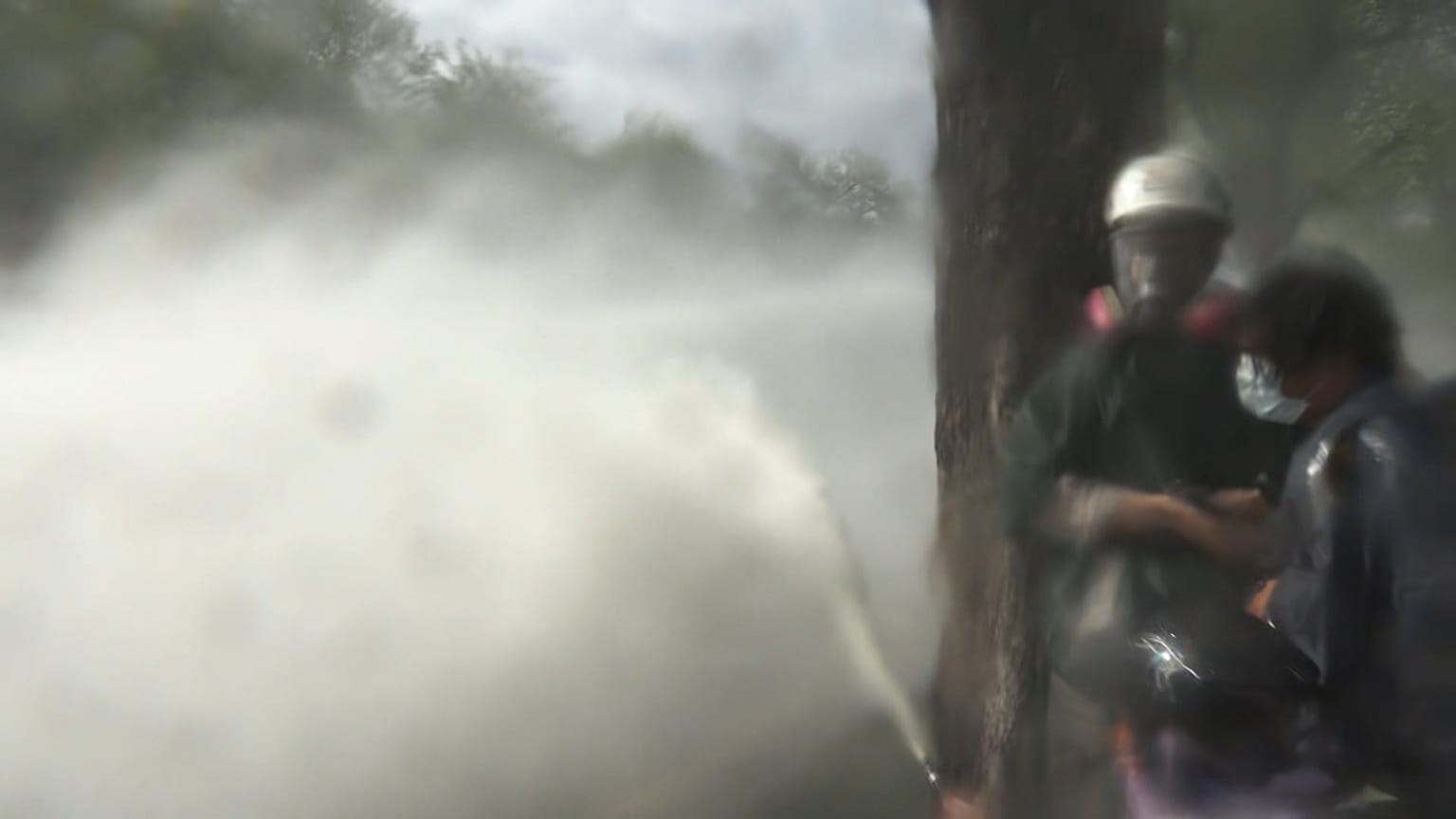 Police firing water canon and tear gas to disperse protesters