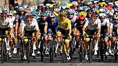 Slovenia's Tadej Pogacar, wearing the overall leader's yellow jersey,  rides with his UAE Team Emirates teammates during the last stage of the Tour de France, 18 July, 2021.  