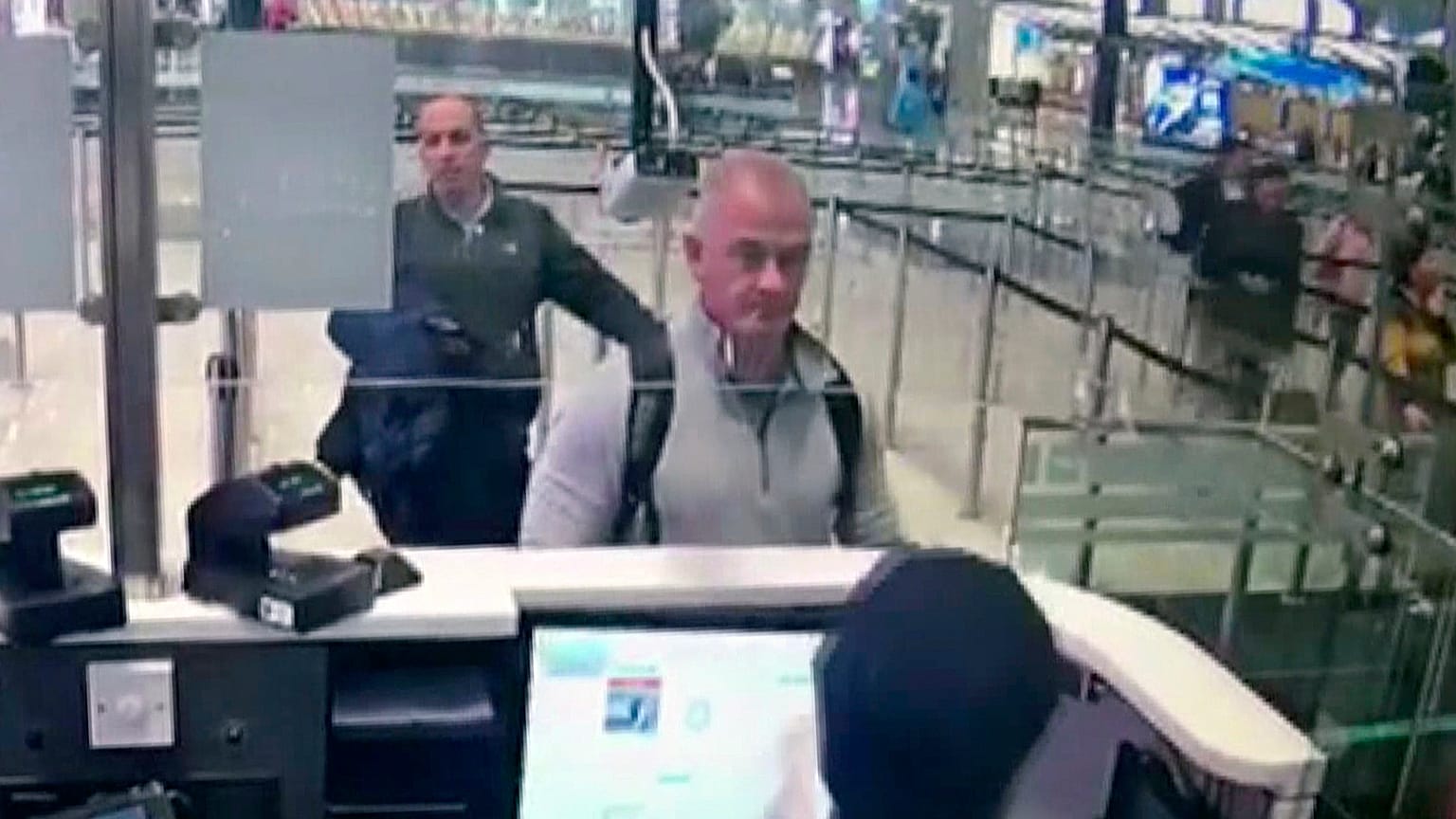 Michael L. Taylor, center, and George-Antoine Zayek at passport control at Istanbul Airport in Turkey, on December 30, 2019.