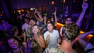 People react on the dance floor shortly after the reopening, at The Piano Works in Farringdon, in London, Monday, July 19.