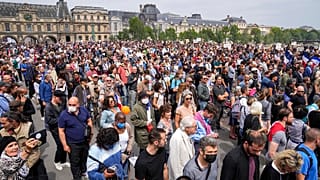 Anti-vaccine protesters march during a rally in Paris, Saturday, July 17, 2021.