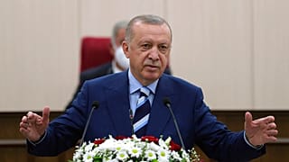 Turkey's President Recep Tayyip Erdogan addresses the Turkish Cypriot parliament in Nicosia as part of a two-day visit on Monday.