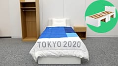 The bed made-up, with the innovative cardboard frame (pictured inset).