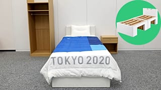 The bed made-up, with the innovative cardboard frame (pictured inset).