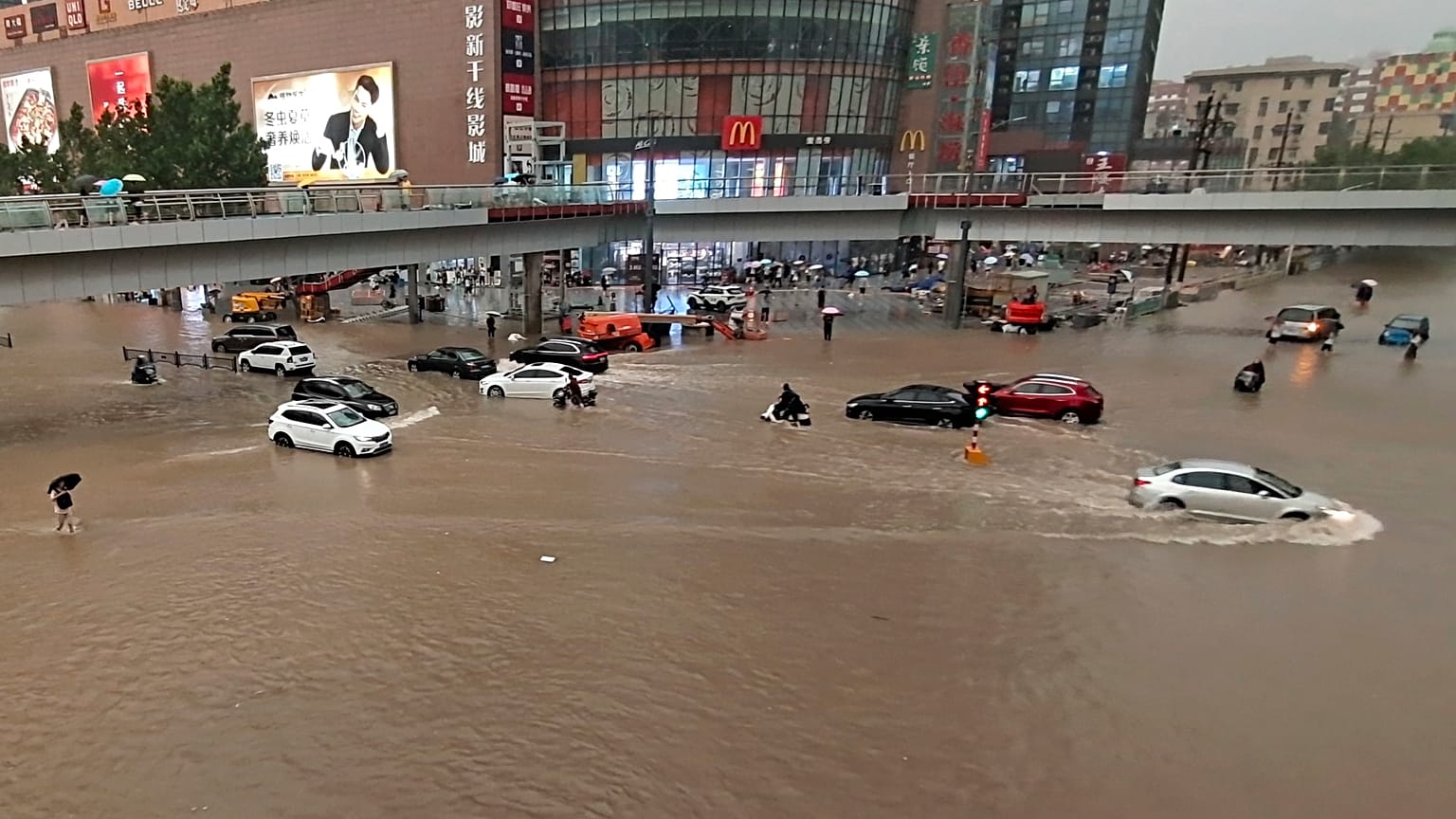 Vehicles are stranded after a heavy downpour in Zhengzhou city, central China