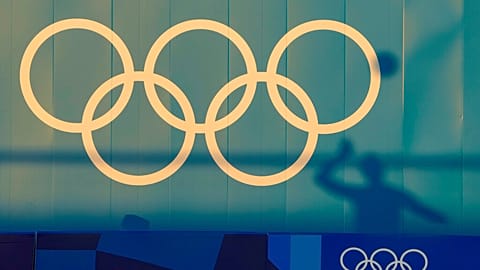 A Germany player is silhouetted against a wall during a Beach Volleyball training session ahead of the 2020 Summer Olympics, Tuesday, July 20, 2021, in Tokyo.