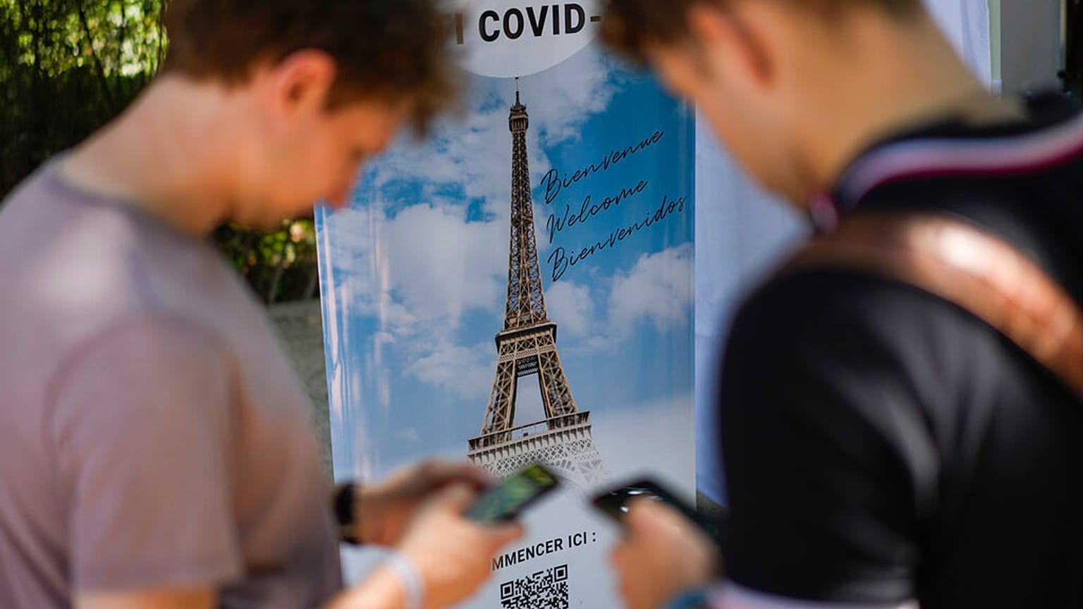 Visitors register for COVID-19 tests at the Eiffel Tower in Paris, Wednesday, July 21, 2021.