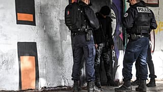 Des policiers contrôlent un homme à Sarcelles, au nord de Paris, le 3 février 2021.