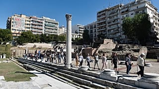 People in Thessaloniki protest against the removal and repositioning of antiquities found during the construction of the Venizelos Metro Station.