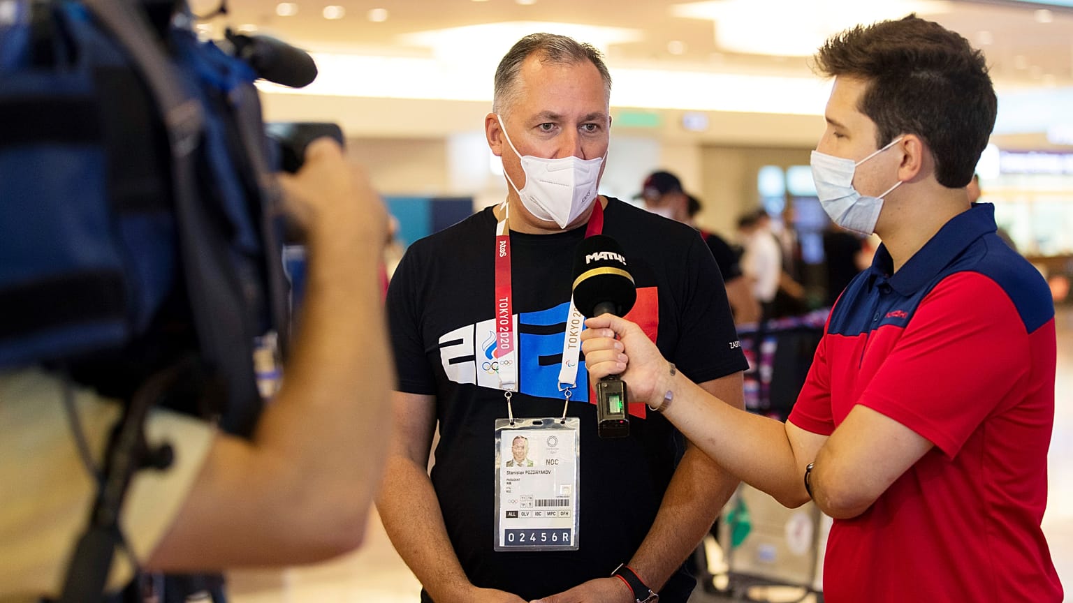 Stanislav Pozdnyakov, president of the Russian Olympic Committee, answers questions as he arrives at the Olympic Games in Tokyo