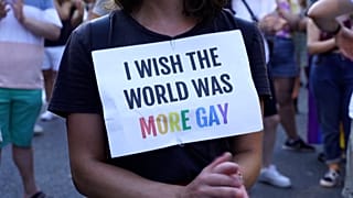 Protesters march and clap