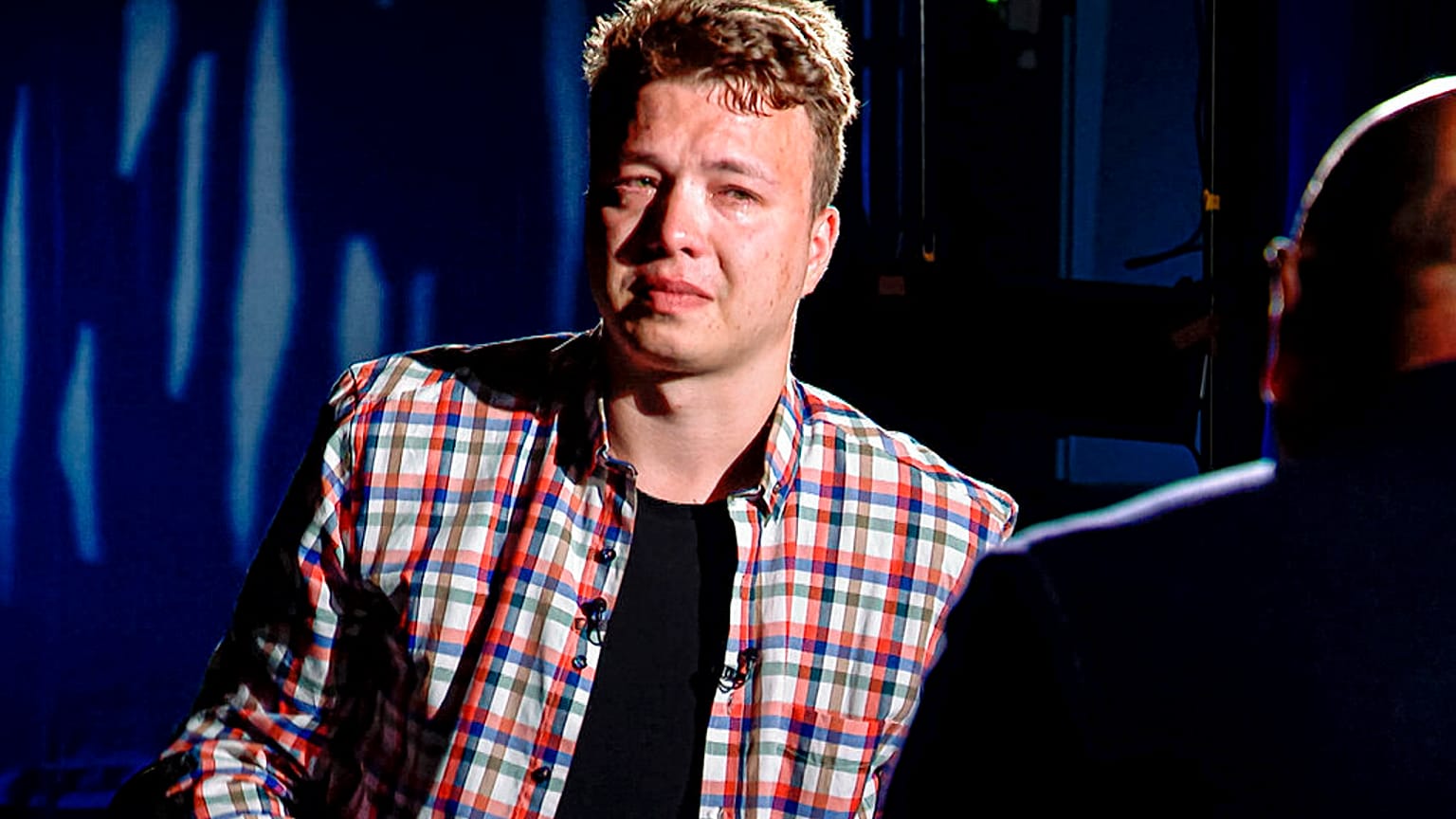 Dissident journalist Roman Pratasevich reacts during his interview with Belarusian ONT Channel in Minsk, Belarus