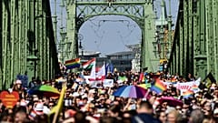 People march across the Szabadsag, or Freedom Bridge over the River Danube in downtown Budapest during a gay pride parade