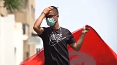 Anti-government demonstrator rallying in front of the Parliament in the capital Tunis