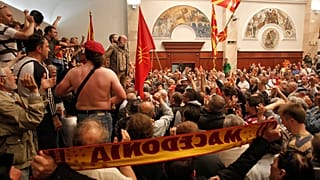 Scores of protesters broke through a police cordon and entered Macedonian parliament in April 2017.