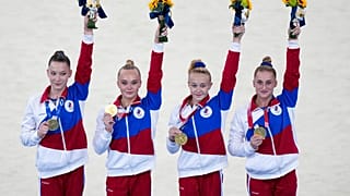 Russian Olympic Committee's artistic gymnastics women's team, from right, Liliia Akhaimova, Viktoriia Listunova, Angelina Melnikova and Vladislava Urazova celebrate.
