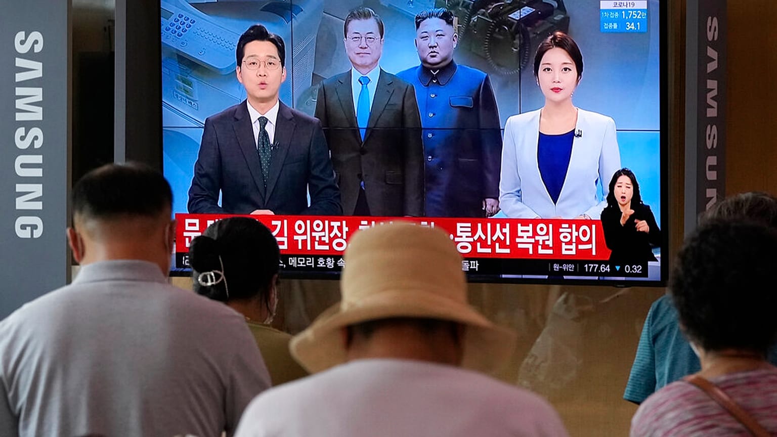 A news program at the Seoul Railway Station in Seoul, South Korea, Tuesday, July 27, 2021. 