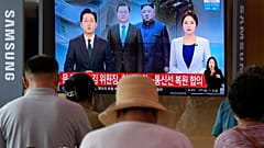 A news program at the Seoul Railway Station in Seoul, South Korea, Tuesday, July 27, 2021. 