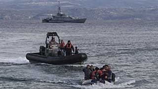 A dinghy with 15 Afghan refugees, 5 children, 3 women and 7 men, approaches the Greek island of Lesbos