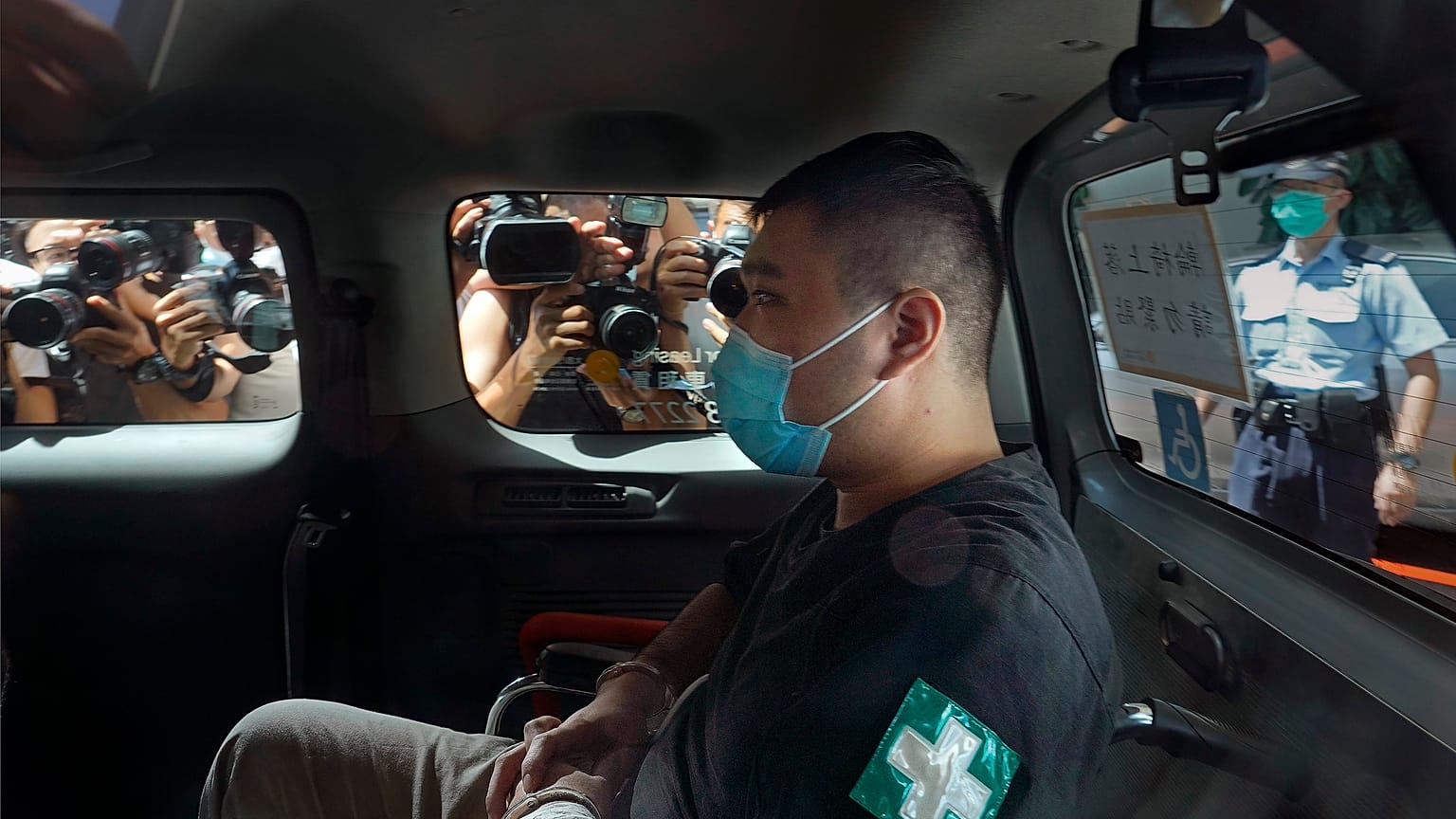Tong Ying-kit arrives at court in a police van in Hong Kong in July 2020.