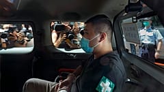 Tong Ying-kit arrives at court in a police van in Hong Kong in July 2020.