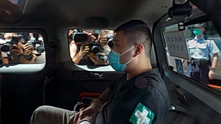 Tong Ying-kit arrives at court in a police van in Hong Kong in July 2020.