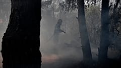 Firefighters battle a wildfire in Dionysos, north east of Athens, on July 27, 2021.