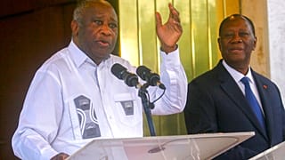 L'ancien président ivoirien Laurent Gbagbo et son successeur encore au pouvoir Alassane Ouattara au palais présidentiel d'Abidjan, 28 juillet 2021