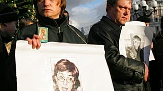 A participant holds a portrait of Anna Politkovskaya during a 2006 unauthorised rally to commemorate journalists who had been killed in Russia.